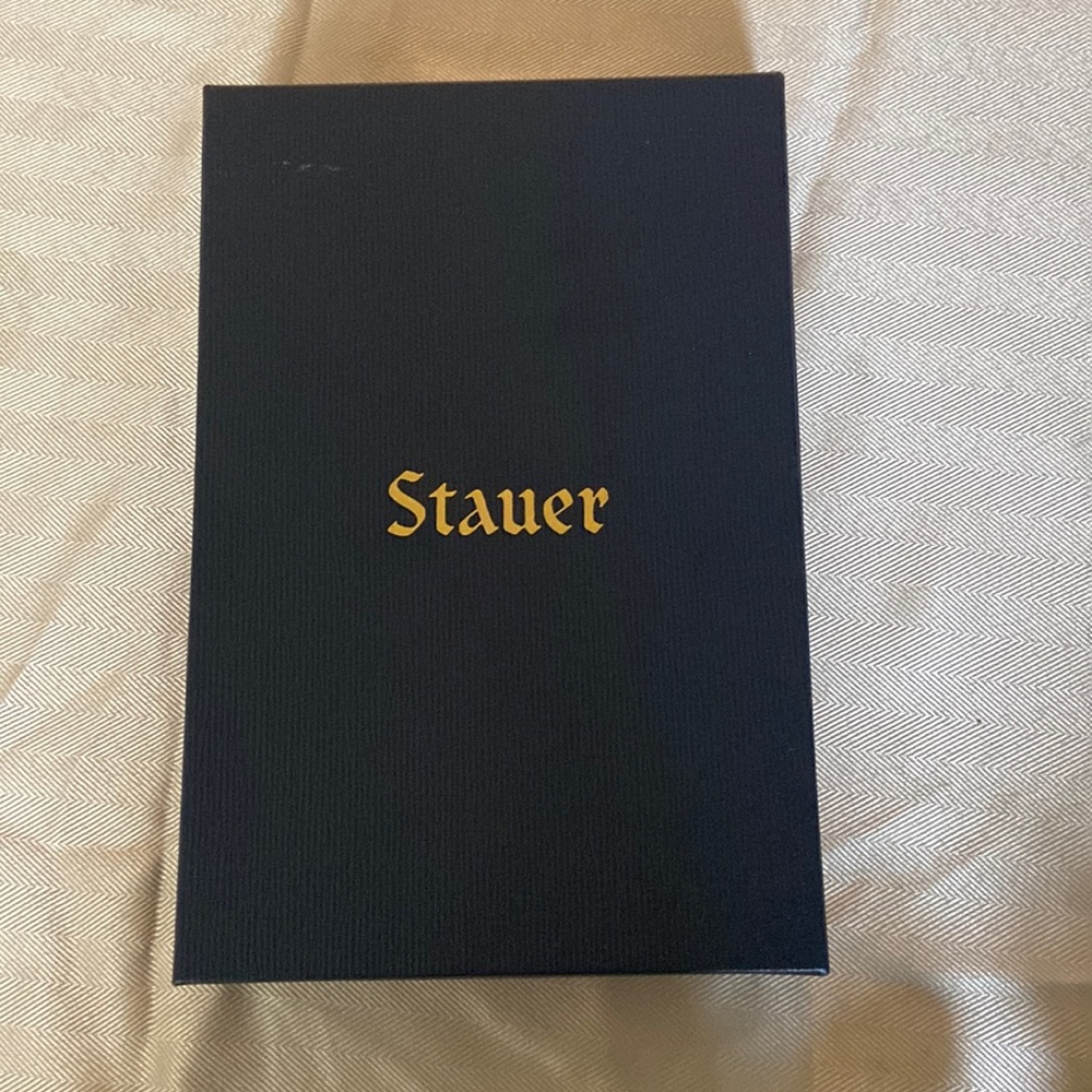 Stauer gold colored necklace, earrings, and bracelet set